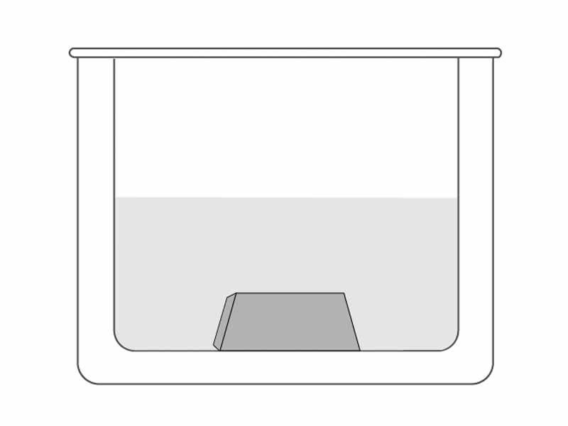 Submerged block of material